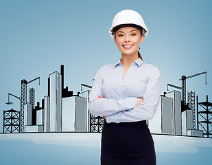 Image showing friendly smiling businesswoman in white helmet