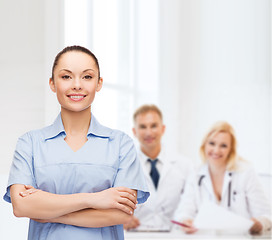 Image showing smiling female doctor or nurse