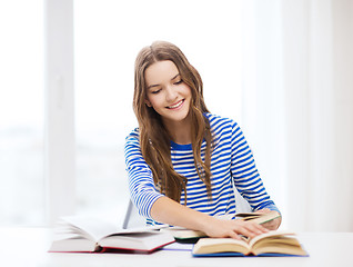 Image showing happy smiling student girl with books