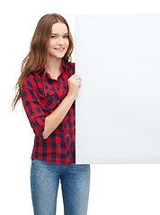 Image showing smiling young teenage girl with white blank board