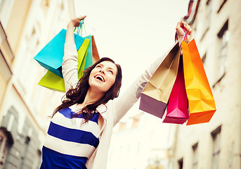 Image showing woman with shopping bags in city