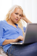 Image showing woman with laptop computer at home