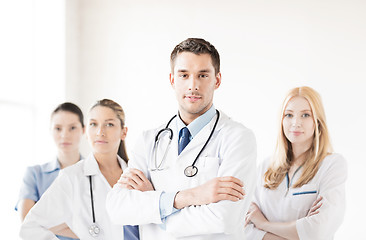 Image showing male doctor in front of medical group