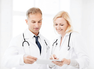 Image showing two doctors looking at tablet pc