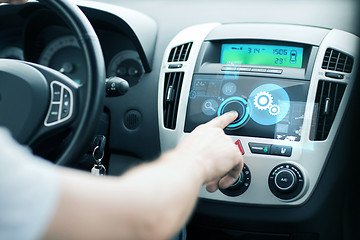 Image showing man using car control panel
