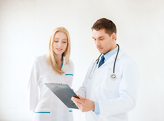 Image showing young male doctor and female nurse in hospital