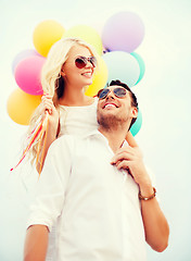 Image showing couple with colorful balloons