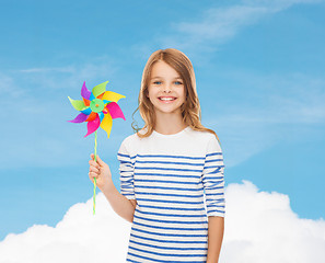 Image showing smiling child with colorful windmill toy