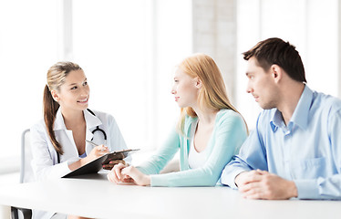 Image showing doctor with patients in cabinet