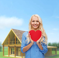 Image showing smiling woman with red heart