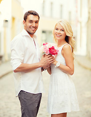 Image showing couple with flowers in the city