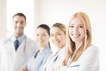 Image showing female doctor in front of medical group