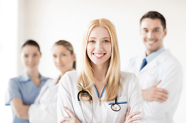 Image showing female doctor in front of medical group