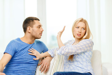 Image showing unhappy couple having argument at home