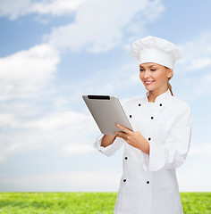 Image showing smiling female chef with tablet pc computer