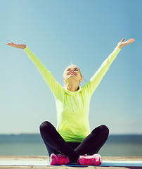 Image showing woman doing yoga outdoors