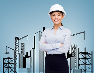 Image showing friendly smiling businesswoman in white helmet