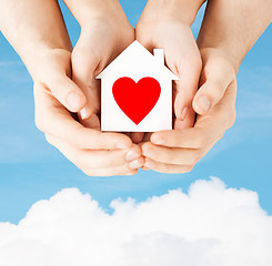 Image showing couple hands holding white paper house