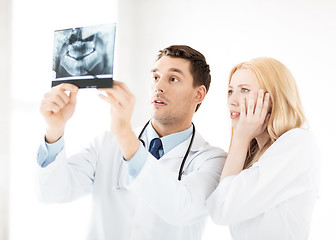 Image showing two doctors looking at x-ray