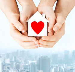 Image showing couple hands holding white paper house