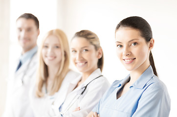 Image showing female doctor in front of medical group