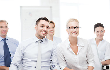 Image showing businessmen and businesswomen on conference