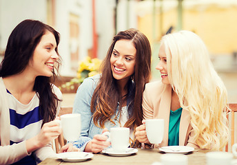 Image showing beautiful girls drinking coffee in cafe