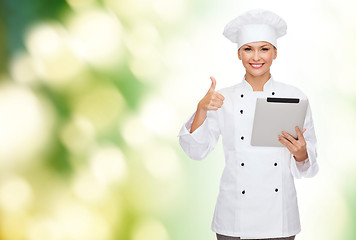 Image showing smiling female chef with tablet pc computer