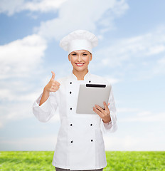 Image showing smiling female chef with tablet pc computer