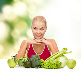 Image showing smiling sporty woman with organic food