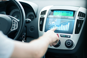 Image showing man using car control panel