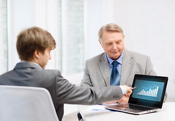 Image showing older man and young man with laptop computer