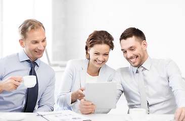Image showing business team having fun with tablet pc in office