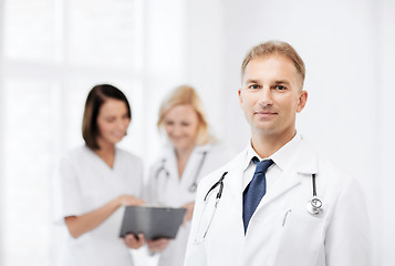 Image showing male doctor with colleagues