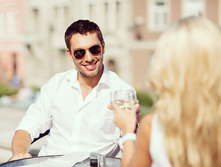 Image showing couple drinking wine in cafe