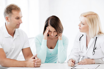 Image showing doctor with patients in cabinet