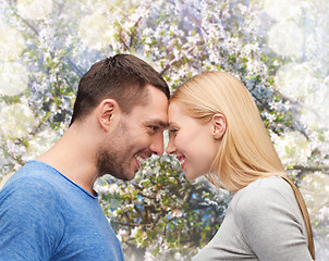 Image showing smiling couple looking at each other