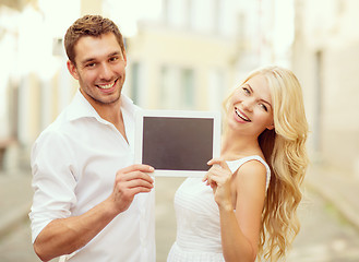 Image showing couple with tablet pc in the city