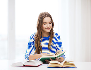 Image showing happy smiling student girl with books