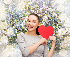 Image showing smiling asian woman with red heart