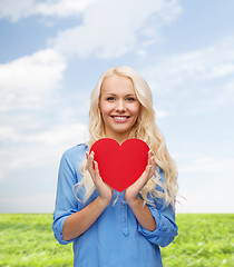 Image showing smiling woman with red heart