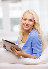 Image showing smiling woman with tablet pc computer at home