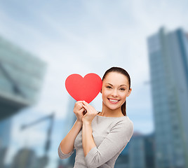 Image showing smiling asian woman with red heart