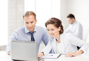 Image showing man and woman working with laptop in office