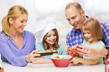 Image showing happy family with two kids eating at home