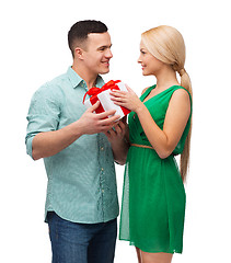 Image showing smiling couple with gift box