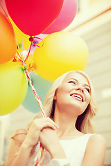 Image showing woman with colorful balloons