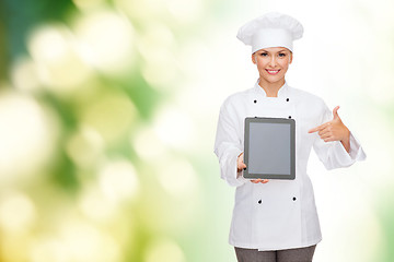 Image showing smiling female chef with tablet pc blank screen