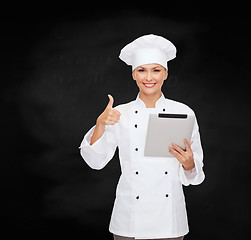 Image showing smiling female chef with tablet pc computer