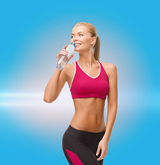 Image showing smiling woman with bottle of water